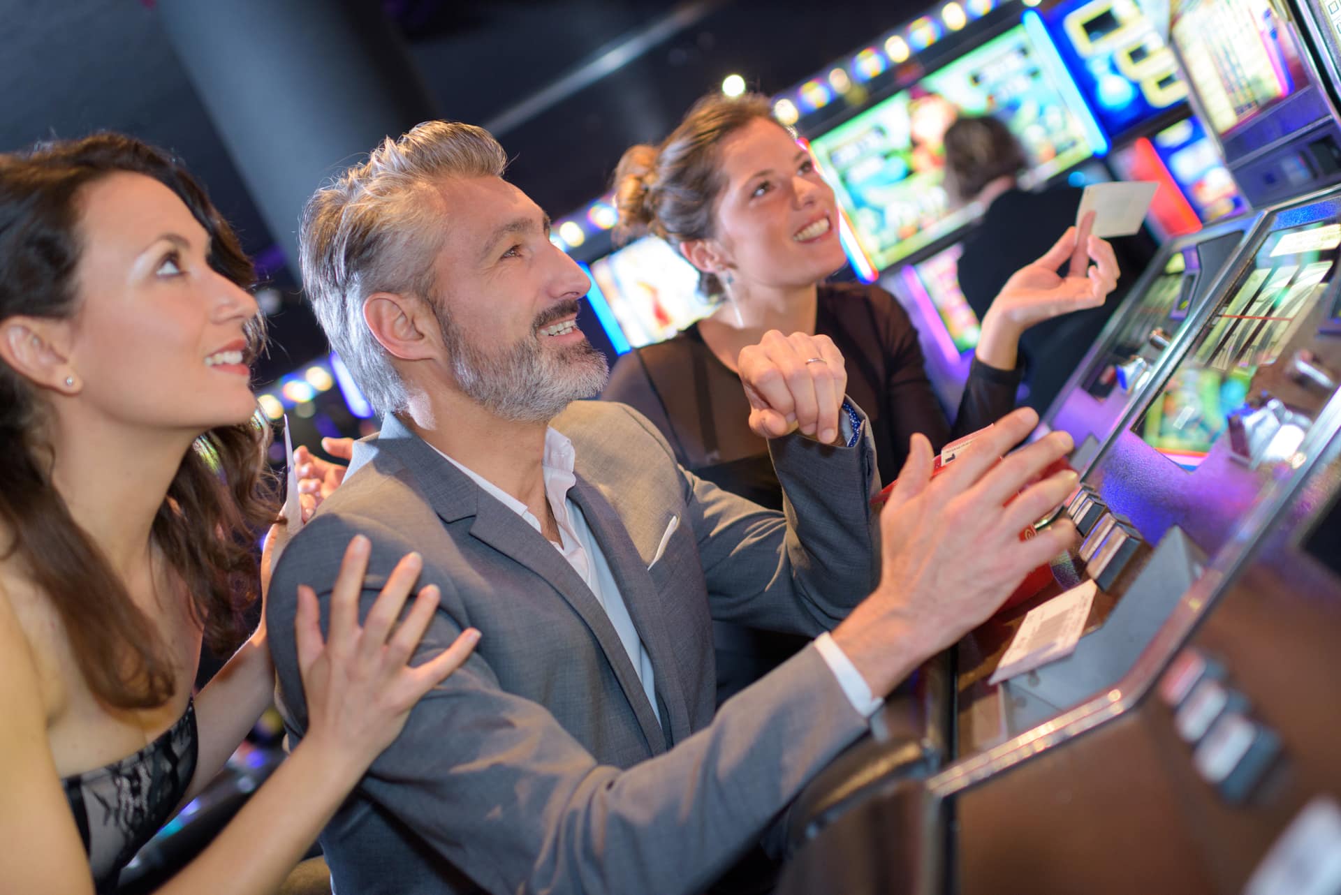 Guests playing slot machines on the casino floor